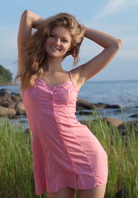 Shapely youthful Patritcy baring tiny tits and sexy ass on the beach